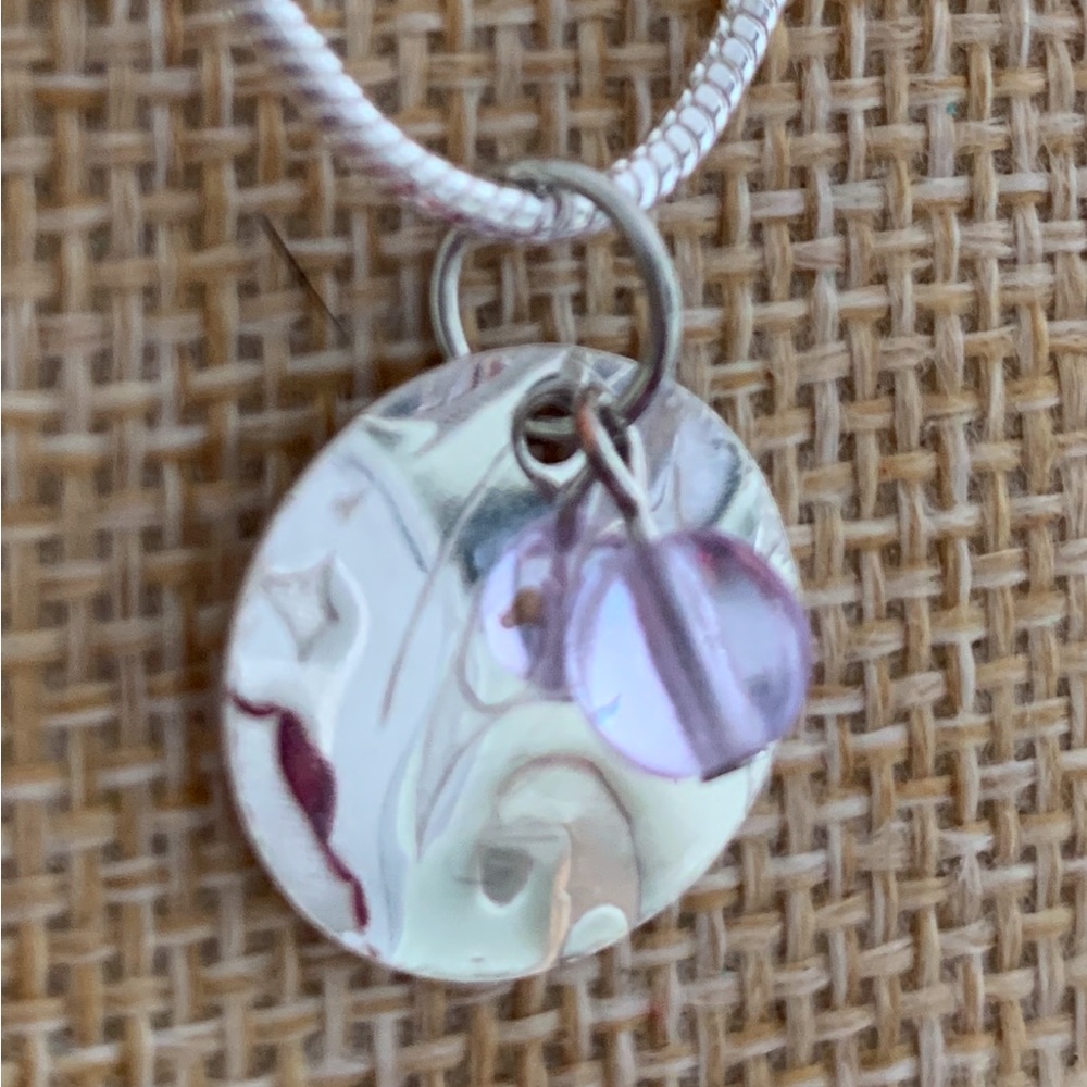 Color changing neodymium dichroic glass and sterling pendant. Artisan made.